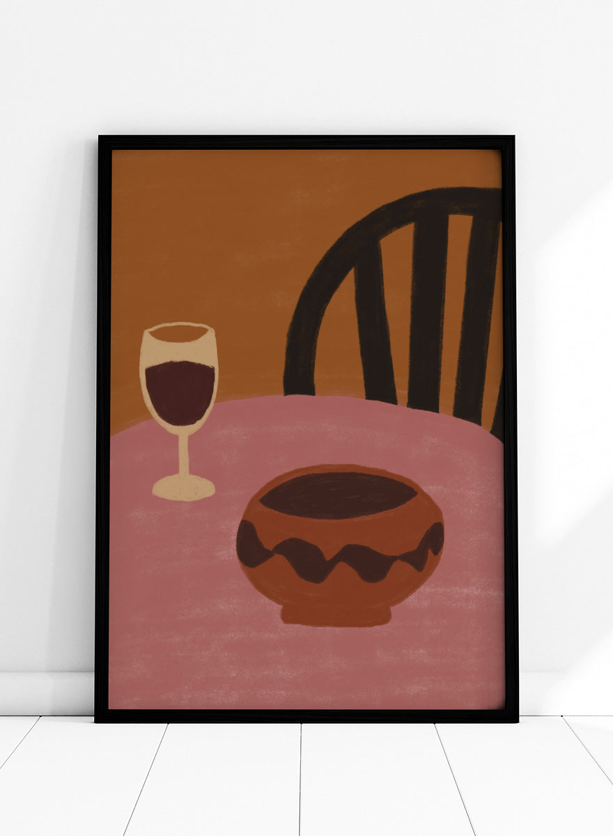 A stylized still life artwork showing a pink table, a dark brown bowl in the foreground, a wine glass with deep red liquid, and a black chair against a warm brown background. Warm Dining Still Life by The Art Concept still life art print featuring red wine, a rounded bowl, pink tabletop, and rich burgundy and rust tones.