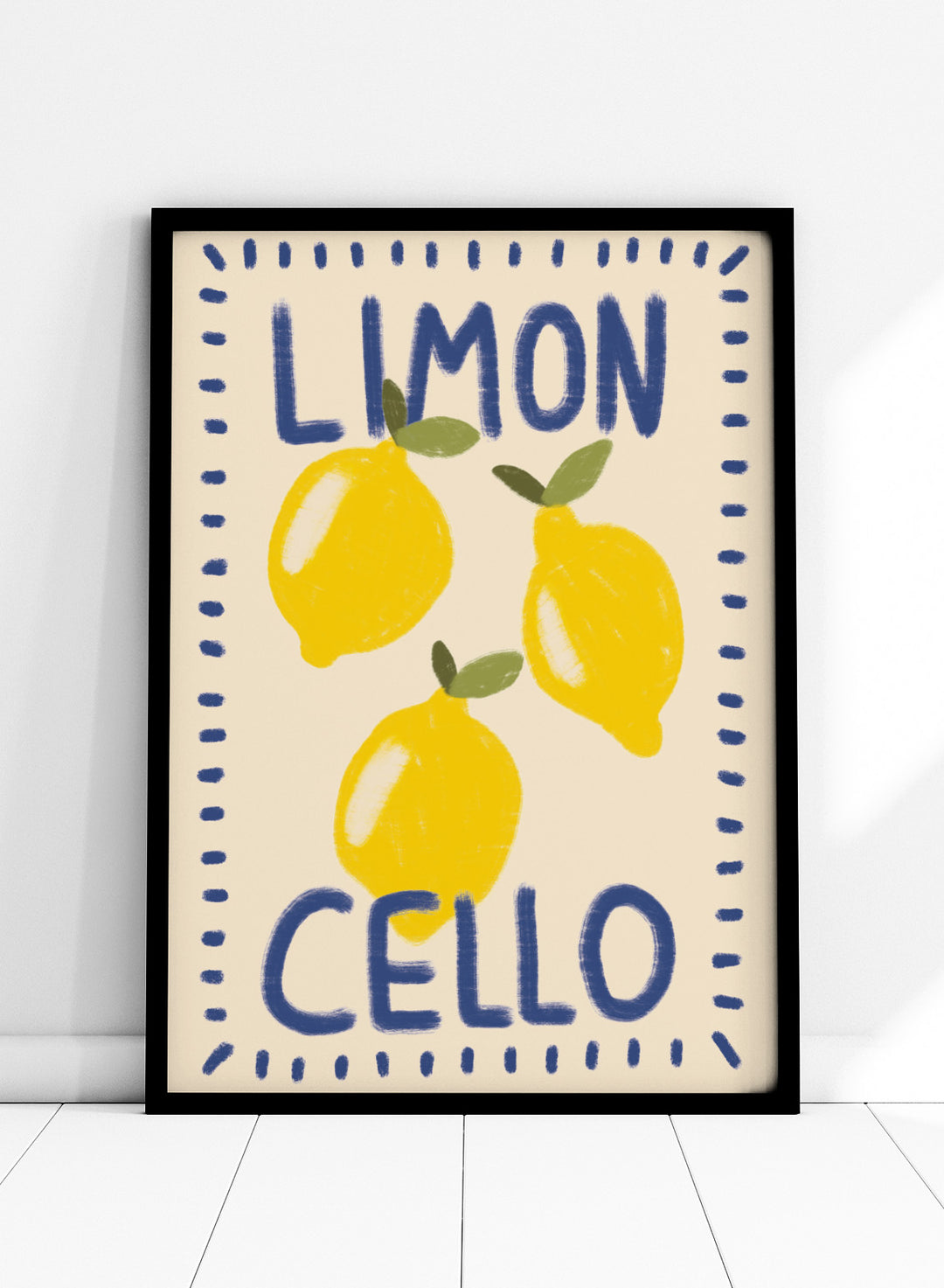 An art print featuring three yellow lemons with green leaves on a cream background, framed by a blue dotted border. The words &