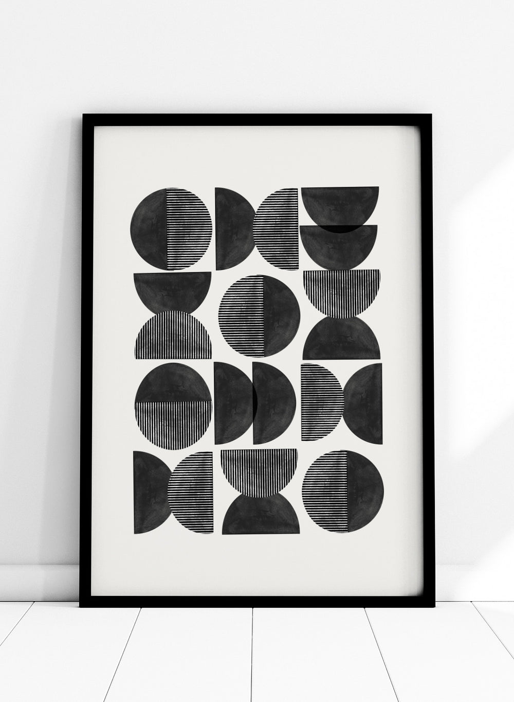Geometric pattern of black semi-circles on a white background. Geometric Rhythm by The MIUUS Studio is a minimalist abstract art print and wall poster featuring repeating geometric shapes, black and white tones, and modern striped textures.