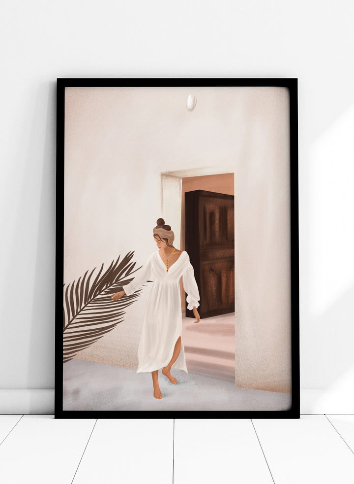 Woman in a white dress standing in a doorway with a palm leaf in the foreground. Woman With Palm Leaf by City Art is a modern figurative art print featuring a woman in a white dress, tropical greenery, warm neutrals, and Mediterranean style.