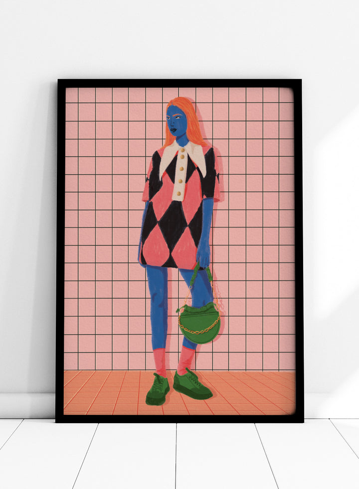 A stylized fashion illustration of a person with blue skin and orange hair, wearing a pink and black harlequin dress with a white collar, blue leggings, green shoes, and carrying a green bag, set against a pink grid background. Vibrant Argyle Style by Lisa Solomoniuk premium framed fine art print featuring a bold fashion figure in bright pink, blue, green, and black.