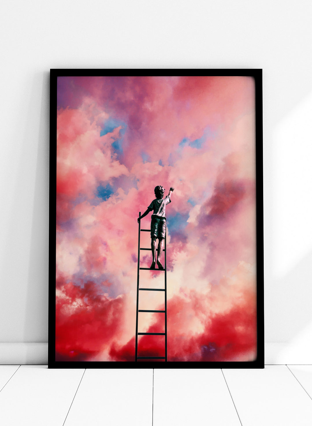 Person standing on a ladder against a colorful cloud sky. Cloud Painter by Taudalpoi surreal ladder to sky art print with pink clouds and dreamlike cosmic atmosphere, retro inspired collage poster wall art.