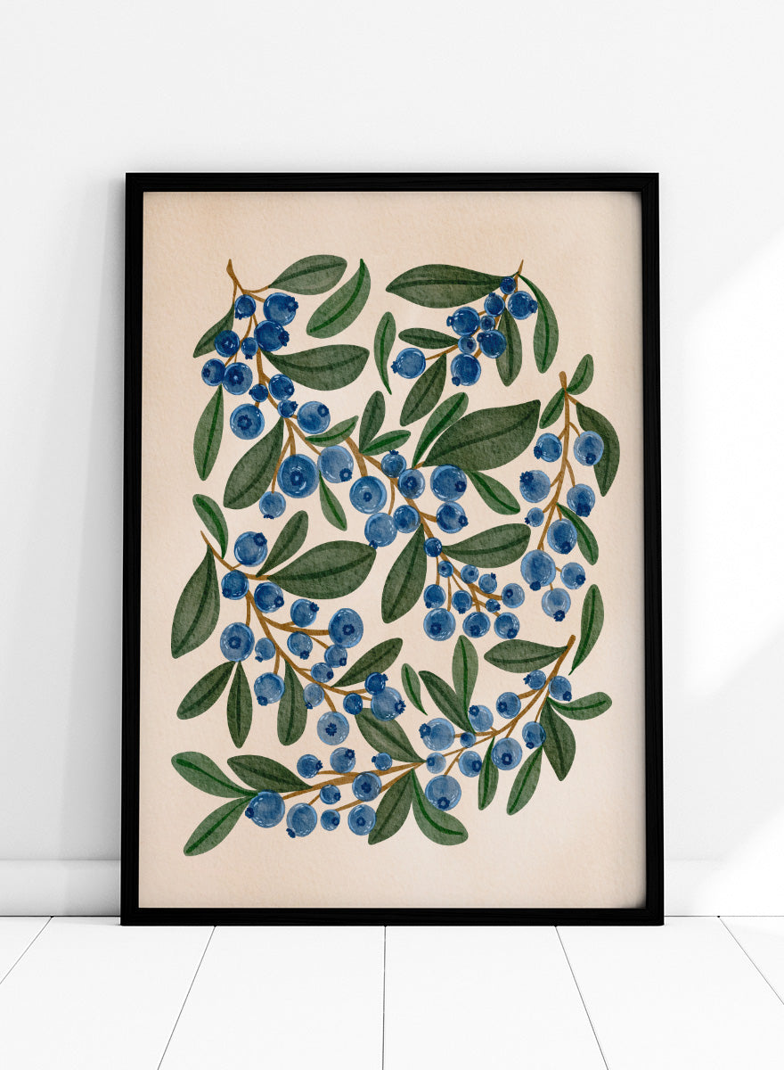 Botanical art print of blueberry branches with green leaves on a warm beige background. Shop Fresh Blueberry Sprigs by Nikita Jariwala, a botanical wall art print poster featuring blueberry branches, deep blue berries, and leafy green summer detail.