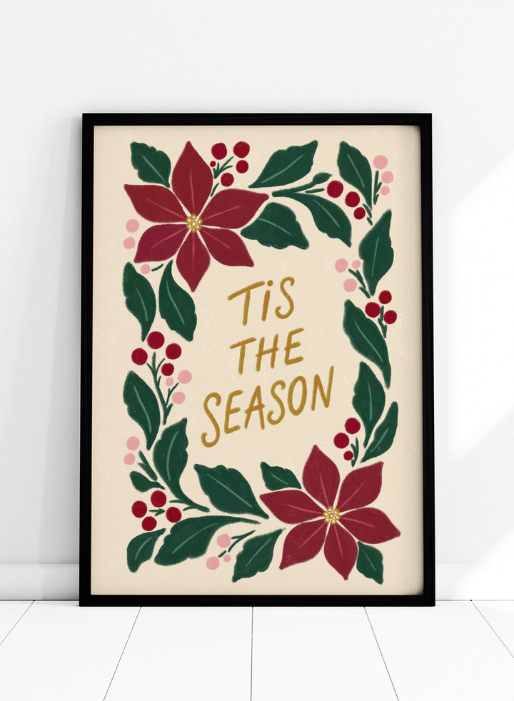 Shop Tis The Season Wreath by Katarzyna Gąsiorowska, a Christmas wall art print poster featuring poinsettias, berries, greenery, and festive holiday lettering.