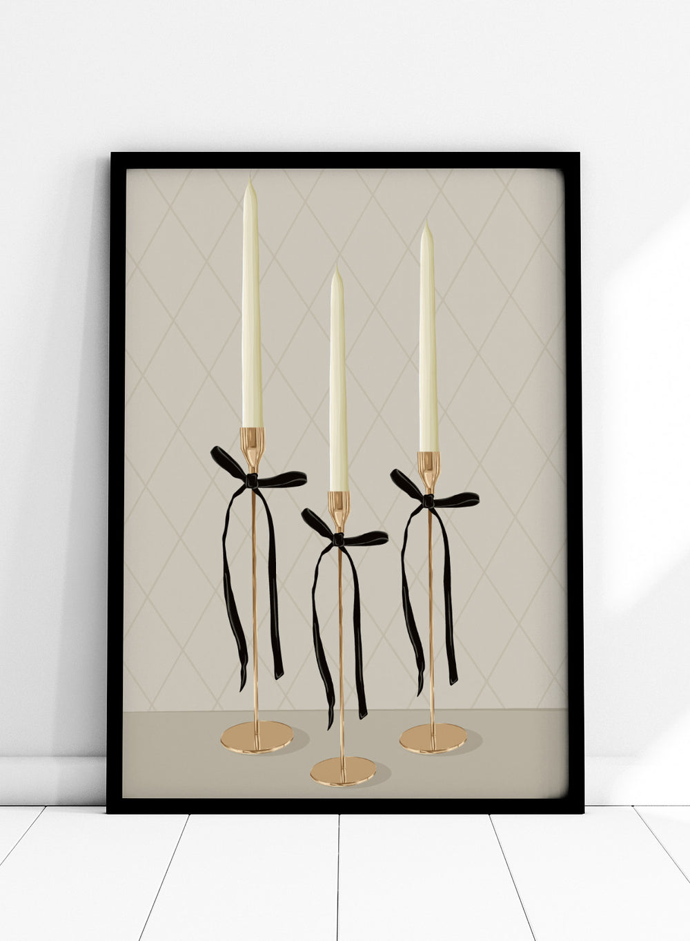 Three gold taper candle holders with cream candles and black ribbon bows, arranged on a light gray surface against a beige diamond-patterned background. Elegant Gold Taper Candles by Lisa Solomoniuk premium framed fine art print featuring gold candlesticks, cream tapers, and long black ribbons.