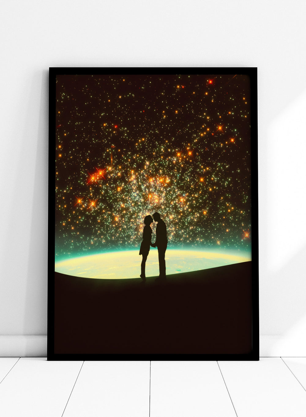 Silhouette of a couple against a starry night sky with Earth in the background. A Cosmic Kiss by Taudalpoi romantic couple silhouette art print with glowing stars and cosmic horizon surreal poster wall art.