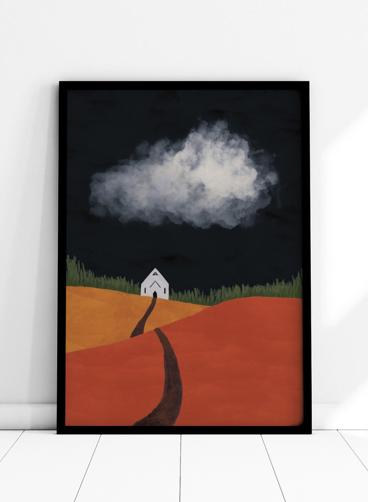 A stylized landscape artwork showing a white house on a hill, a dark winding path, orange and yellow fields, green grass, and a large white cloud against a very dark sky. Winding Path Church by Lisa Solomoniuk premium framed fine art print featuring a small white church beneath a dramatic cloud over red and ochre hills.