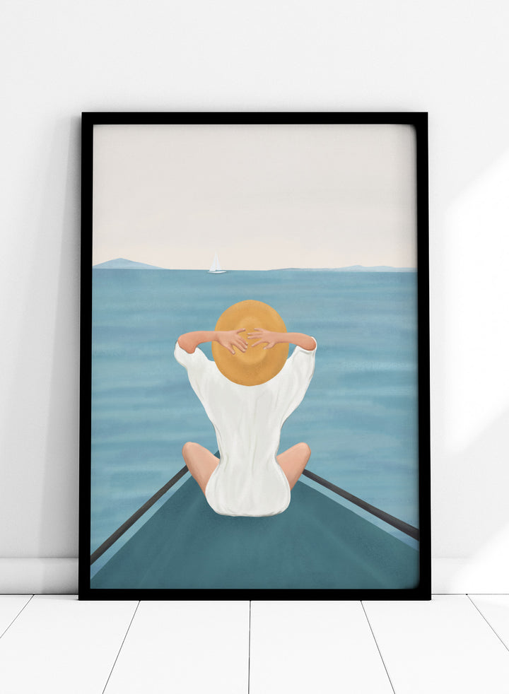Person sitting on a dock over water wearing a white dress and straw hat. Ocean Escape by Flow Line features a woman sitting on a boat overlooking the sea, creating a coastal art print inspired by travel, summer, and ocean living.