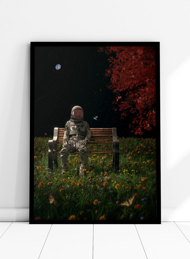Person in astronaut suit sitting on a bench in a garden with flowers and trees at night. Astronaut Space Garden by Nicebleed is a surreal space art print featuring an astronaut on a bench in a floral field under stars, modern aesthetic wall poster.