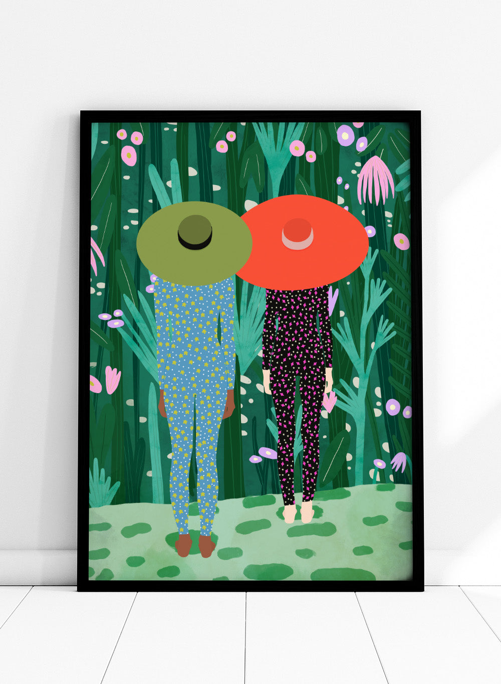 Two people with large hats walking through a lush, colorful forest. Jungle Pajamas by Jota de Jai is an officially licensed fine art wall poster about friendship and quiet connection, available framed or unframed.