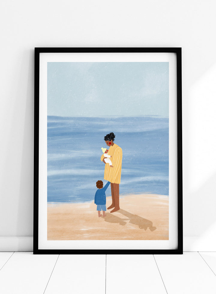 A framed art print featuring an illustration of a man in a yellow striped shirt holding a white dog on a beach next to a child in a blue coat, set against a light blue ocean and pale sky. Family Beach Day by Bea Müller art print featuring a mother with her baby and young child by the sea, created for warm family and coastal decor.
