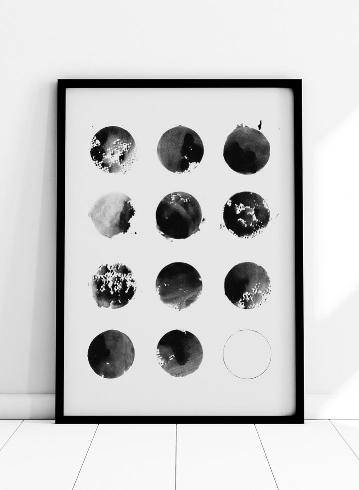 Black and white pattern of circular shapes on a textured background. Fluid Black Circles by Florent Bodart is a minimalist abstract art print with black ink circles, a modern black and white wall poster with graphic grid design.