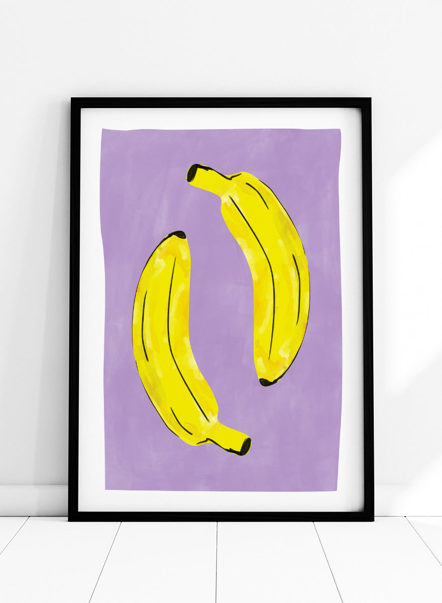 Shop Playful Purple Bananas by Elena Ristova, a colorful banana wall art print poster featuring two bright yellow bananas on a soft purple background with bold black details.