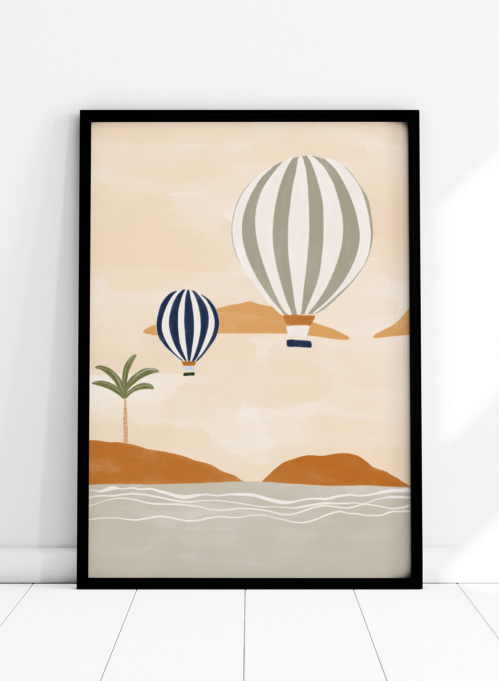 Air Balloons in Desert by Ivy Green is a modern landscape art print featuring hot air balloons over a calm desert scene. Premium fine art print with optional wood framing.