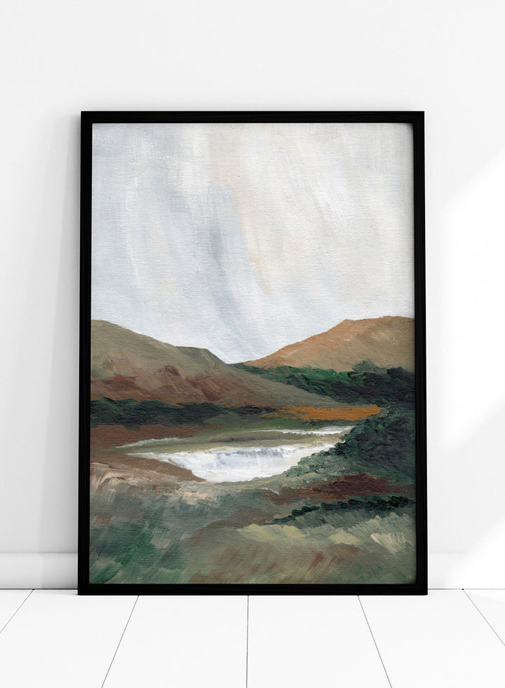 An impressionistic landscape painting of a river or waterfall flowing through a valley, with brown and green hills under a pale sky. Shop Serene Mountain Lake by Nikita Jariwala, a mountain landscape wall art print poster featuring a peaceful lake, wooded hills, and soft green tones.