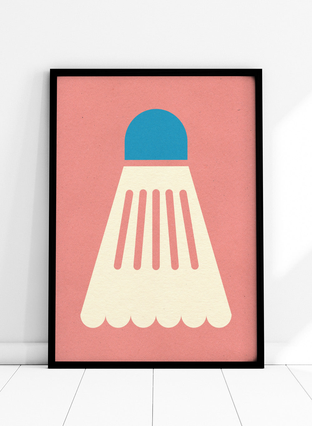 Shuttlecock with blue top and white body on a pink background. Badminton White Blue by Rosi Feist is a modern sports wall art print featuring a minimalist shuttlecock design in bold color and graphic poster style.