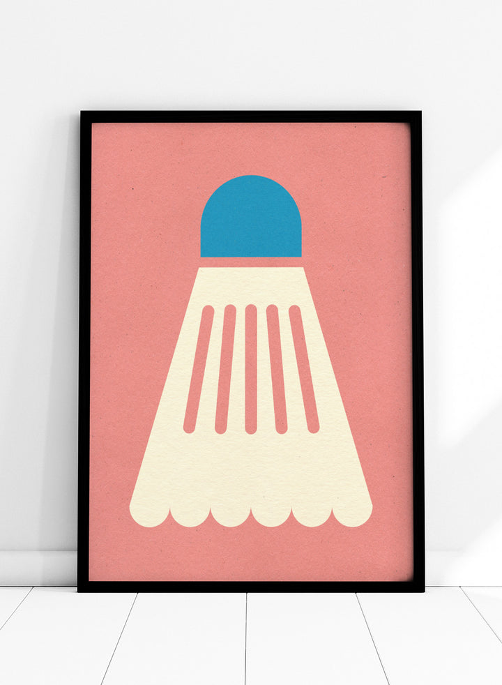 Shuttlecock with blue top and white body on a pink background. Badminton White Blue by Rosi Feist is a modern sports wall art print featuring a minimalist shuttlecock design in bold color and graphic poster style.