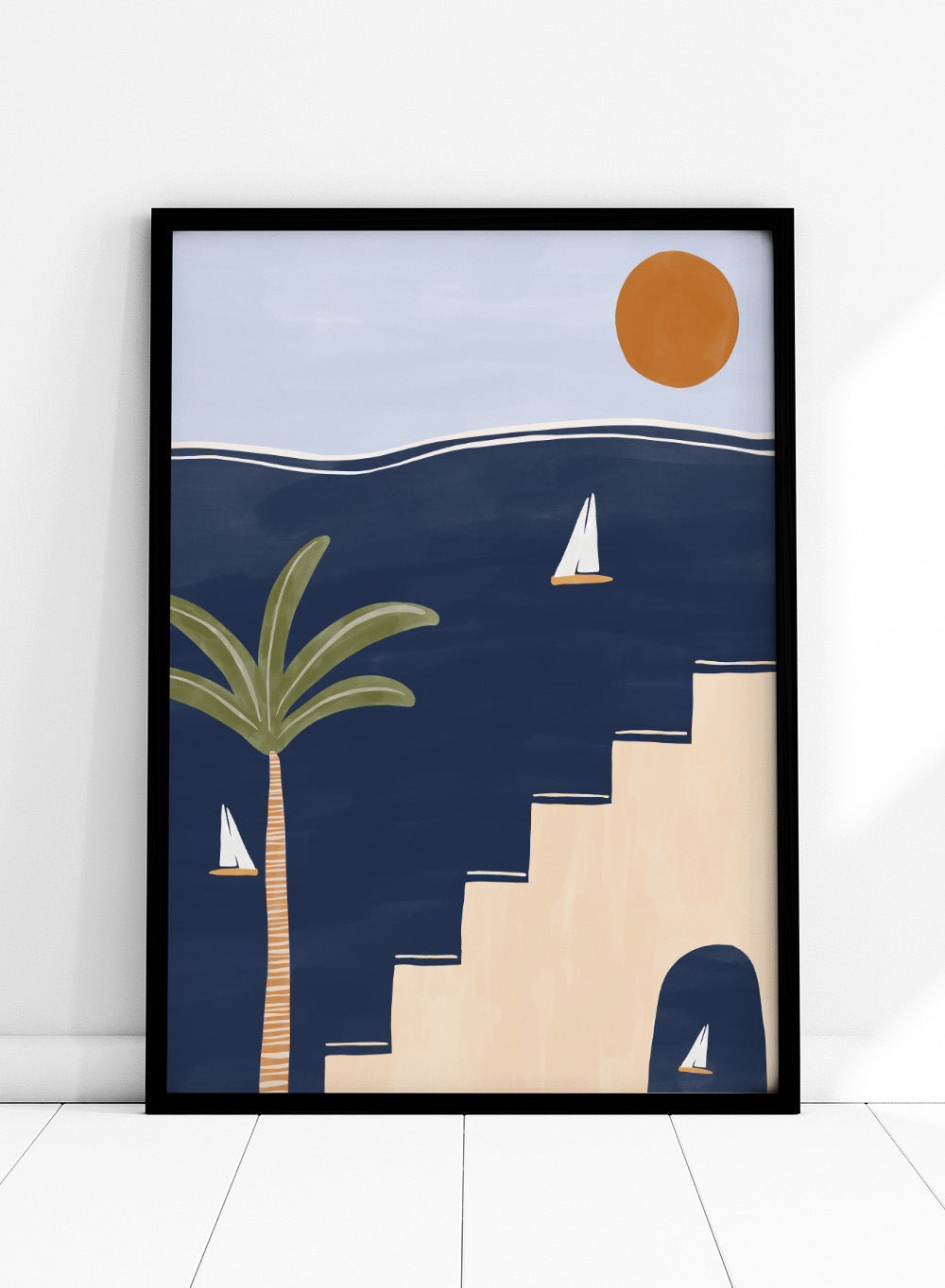 Sailboats by Ivy Green is a modern coastal art print featuring sailboats on deep blue water with palm trees and sun. Premium fine art print with optional wood framing.