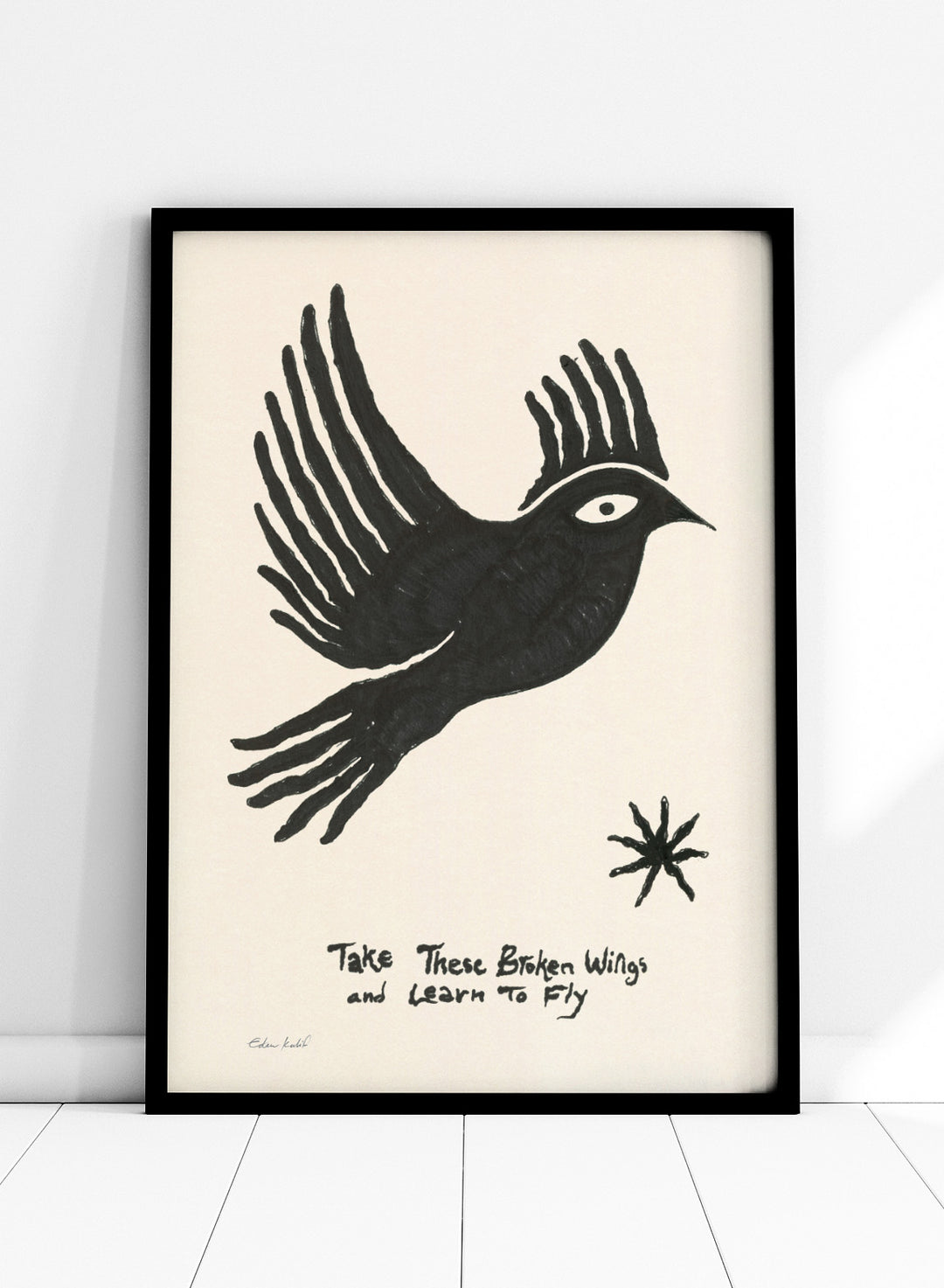 Black bird illustration with 'Take These Broken Wings and Learn to Fly' text on a beige background. Fly Away by Eden Kalif is a modern bird art print with expressive line work and handwritten text, a contemporary minimalist wall poster about growth and freedom.