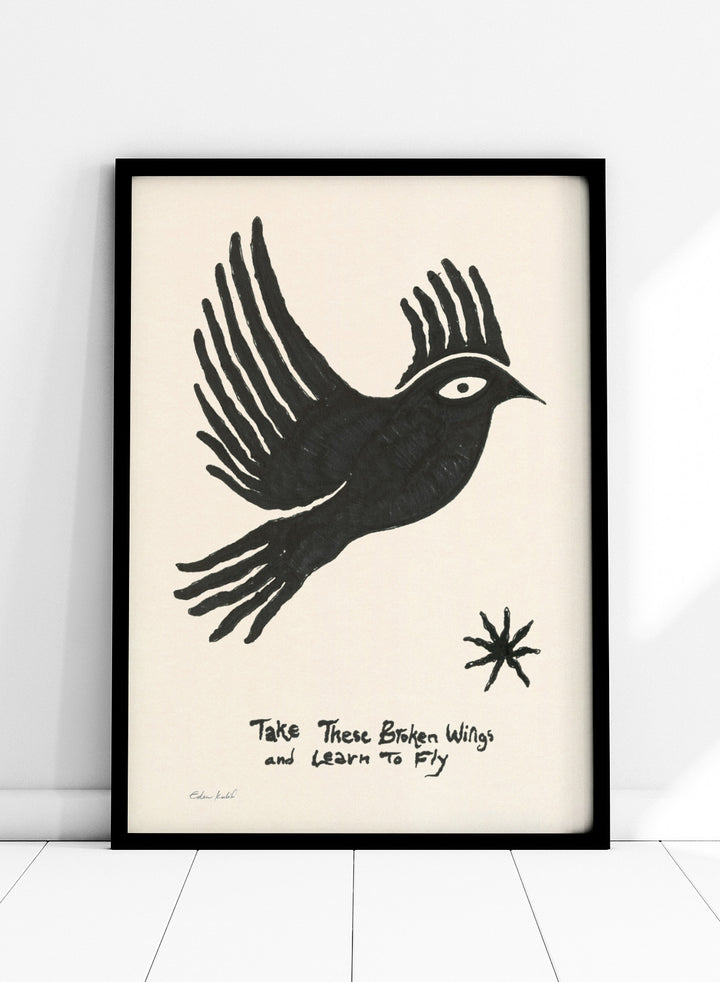 Black bird illustration with 'Take These Broken Wings and Learn to Fly' text on a beige background. Fly Away by Eden Kalif is a modern bird art print with expressive line work and handwritten text, a contemporary minimalist wall poster about growth and freedom.