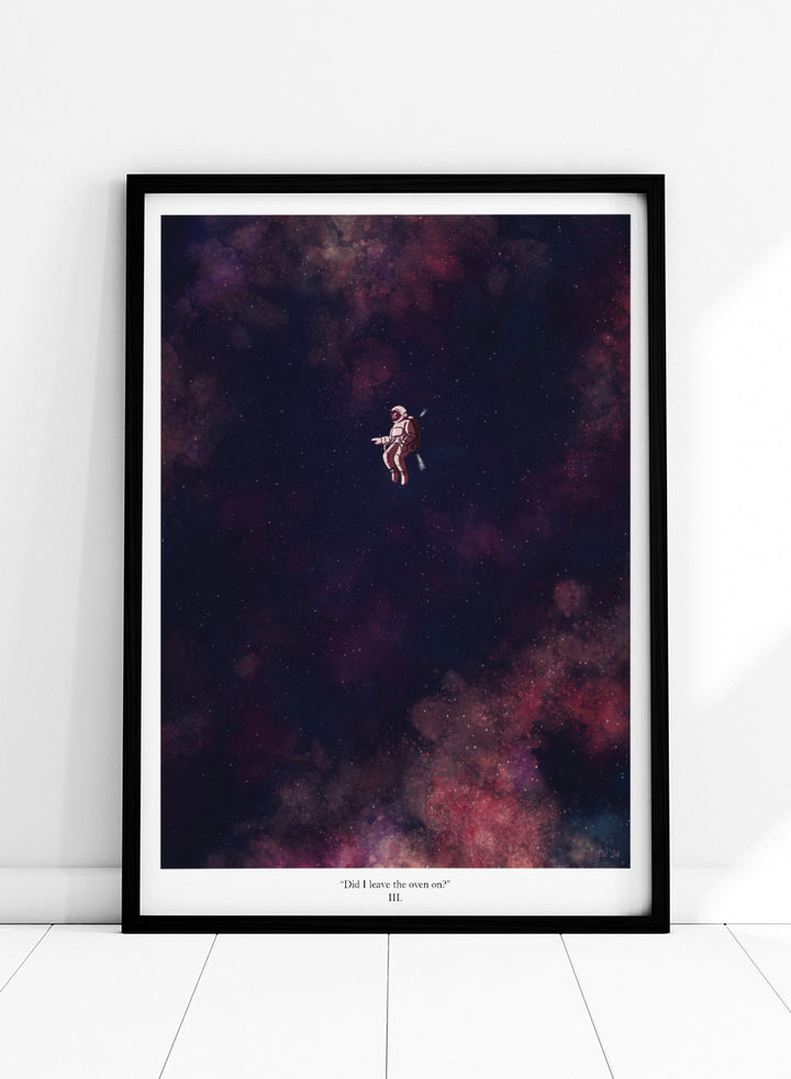 A framed art print featuring an astronaut floating in a starry outer space scene with deep purple, pink, and blue nebulae. The print has a white border with the text &