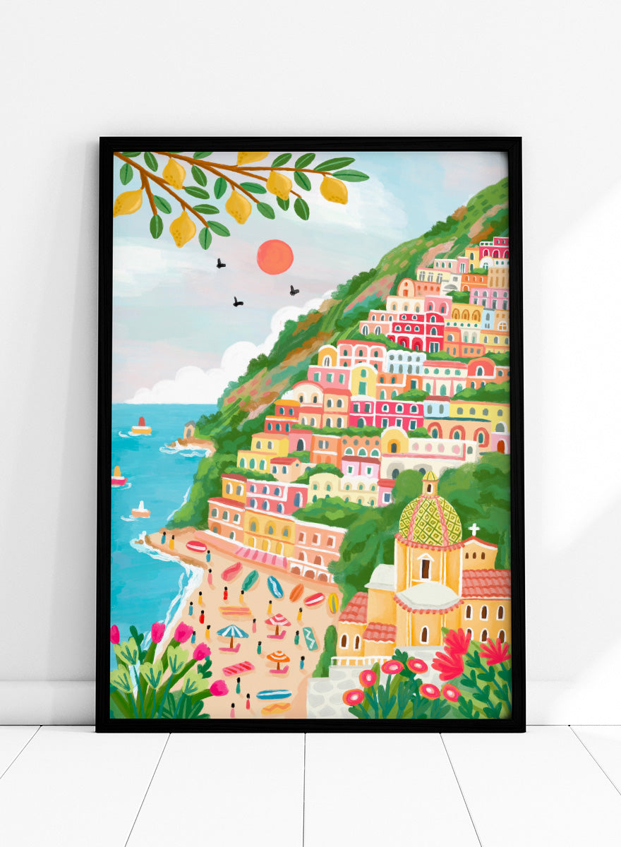 A colorful illustration of a coastal hillside town with tiered pastel buildings, a beach, blue sea, green foliage, and a church dome. Shop Vibrant Seaside Town by Nidhi Kachhadiya, a colorful coastal wall art print inspired by an Italian cliffside village, beach views, and bright Mediterranean color.