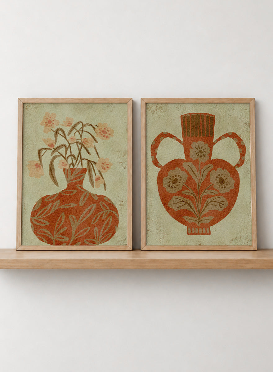 Shop Terracotta Floral Vases by Nikita Jariwala, a set of 2 botanical wall art prints posters featuring floral vase artwork in warm orange tones.