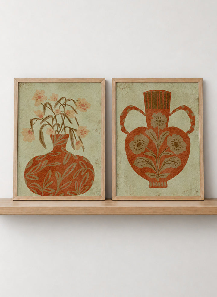 Shop Terracotta Floral Vases by Nikita Jariwala, a set of 2 botanical wall art prints posters featuring floral vase artwork in warm orange tones.