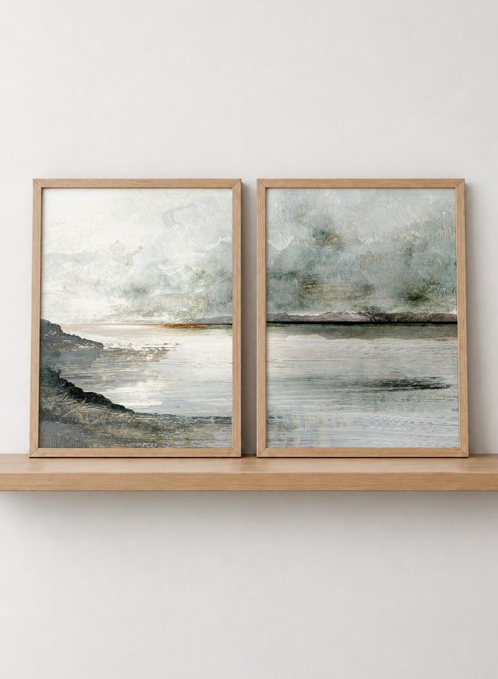 Shop Still Coast by Dan Hobday, a set of 2 coastal landscape wall art prints posters featuring misty water, rocky shoreline, and soft gray and green tones.