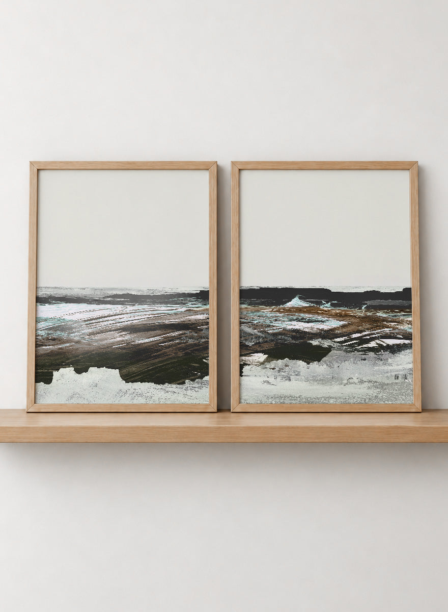 Shop Constantine Bay by Dan Hobday, a set of 2 coastal landscape wall art prints posters featuring windswept shoreline, surf, and muted blue-brown tones.
