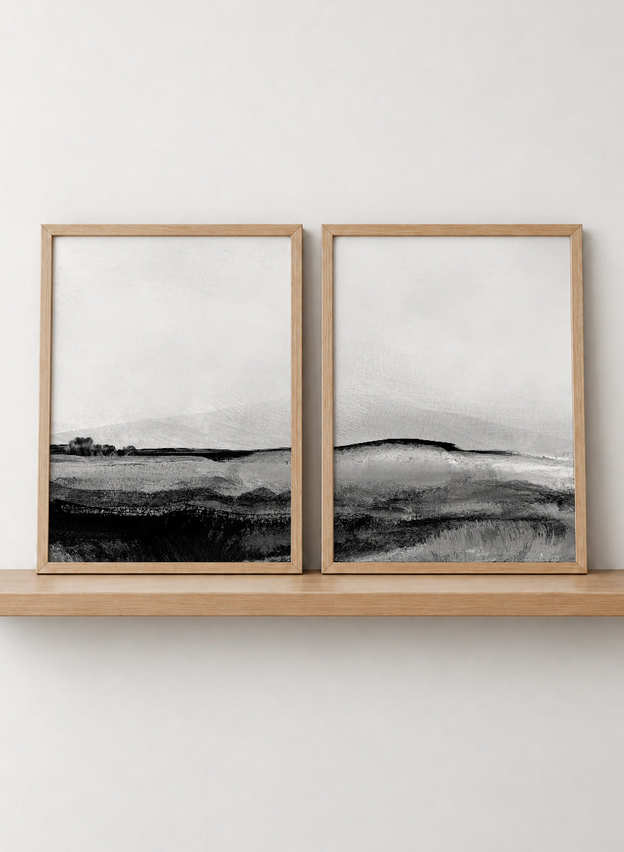 Shop Mono Landscape No.01 by Dan Hobday, a set of 2 black and white landscape wall art prints posters featuring layered hills and moody monochrome gray scenery.