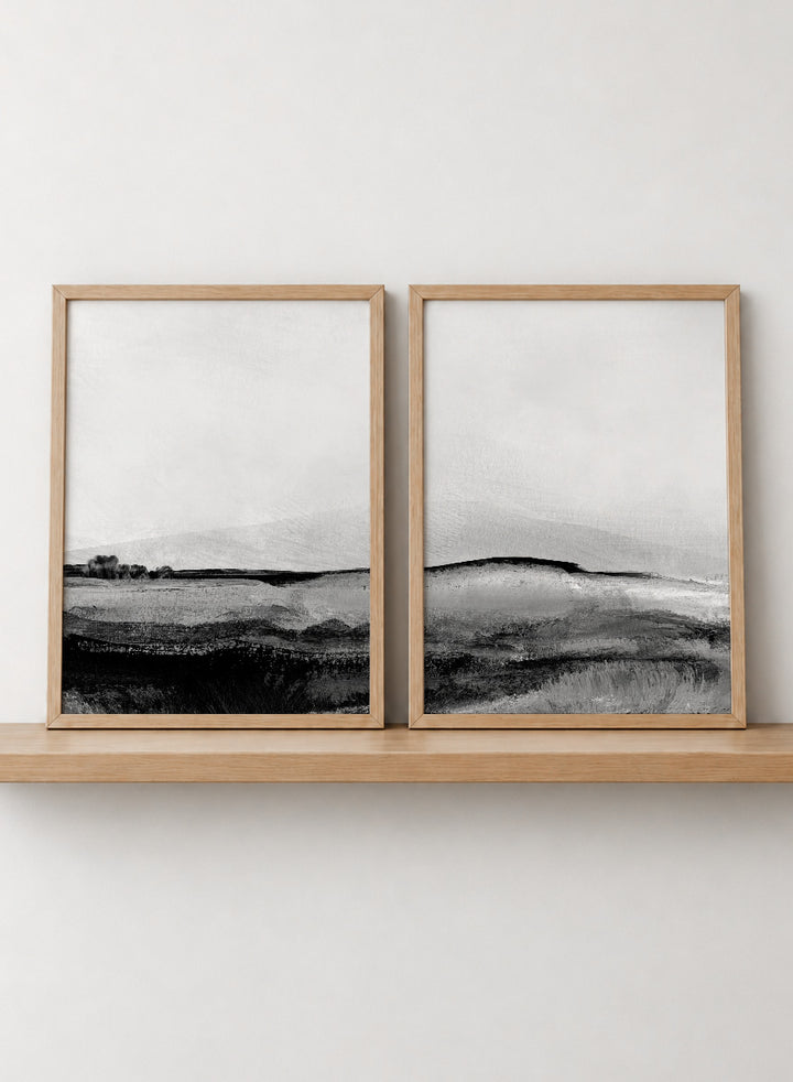 Shop Mono Landscape No.01 by Dan Hobday, a set of 2 black and white landscape wall art prints posters featuring layered hills and moody monochrome gray scenery.