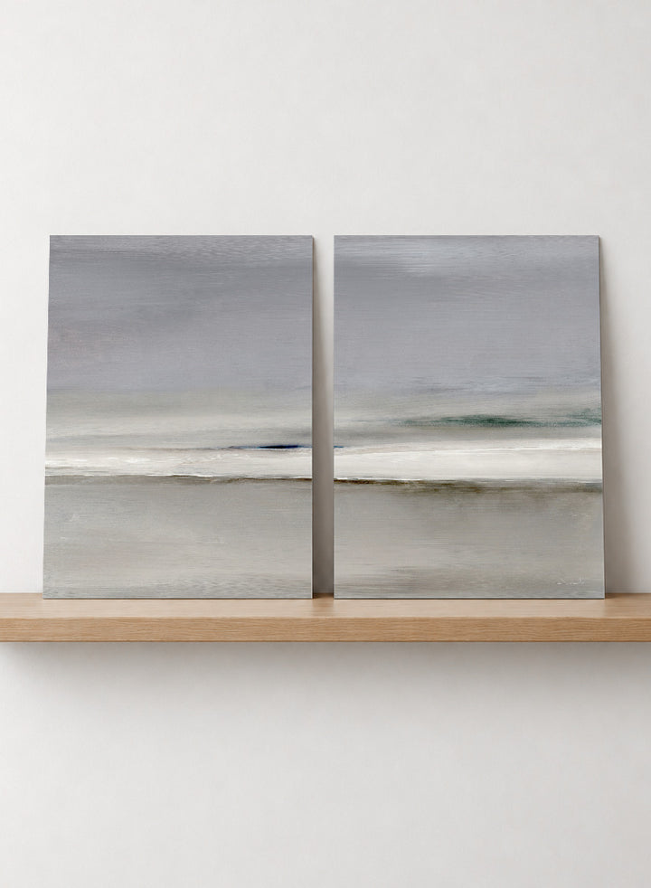 Shop Horizon by Dan Hobday, a set of 2 minimalist landscape wall art prints posters featuring soft gray seascapes, open water, and a quiet horizon.