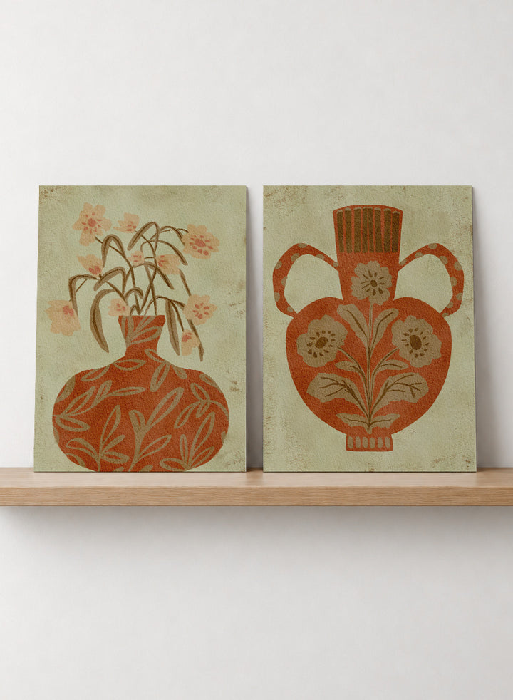 Shop Terracotta Floral Vases by Nikita Jariwala, a set of 2 botanical wall art prints posters featuring floral vase artwork in warm orange tones.