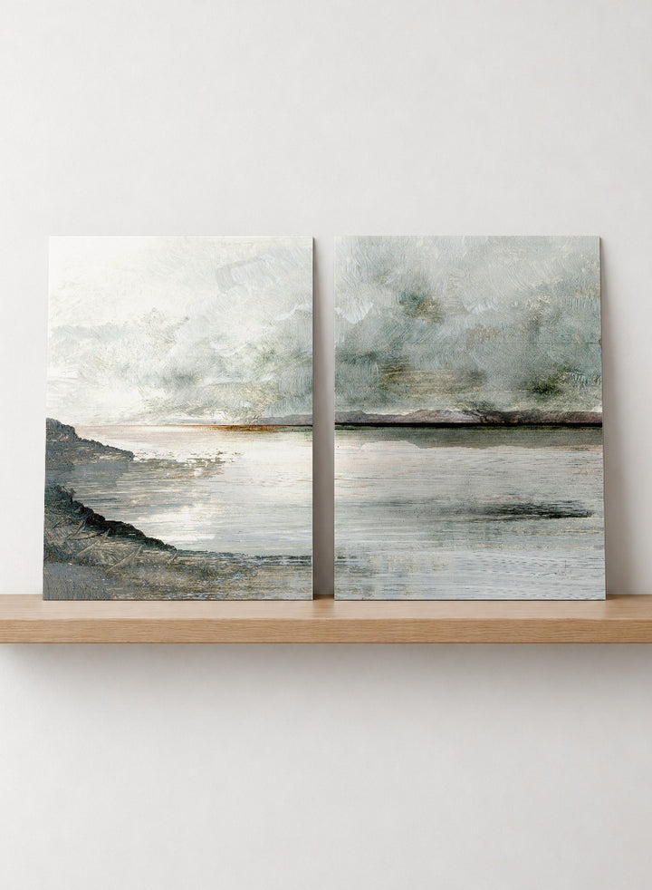 Shop Still Coast by Dan Hobday, a set of 2 coastal landscape wall art prints posters featuring misty water, rocky shoreline, and soft gray and green tones.