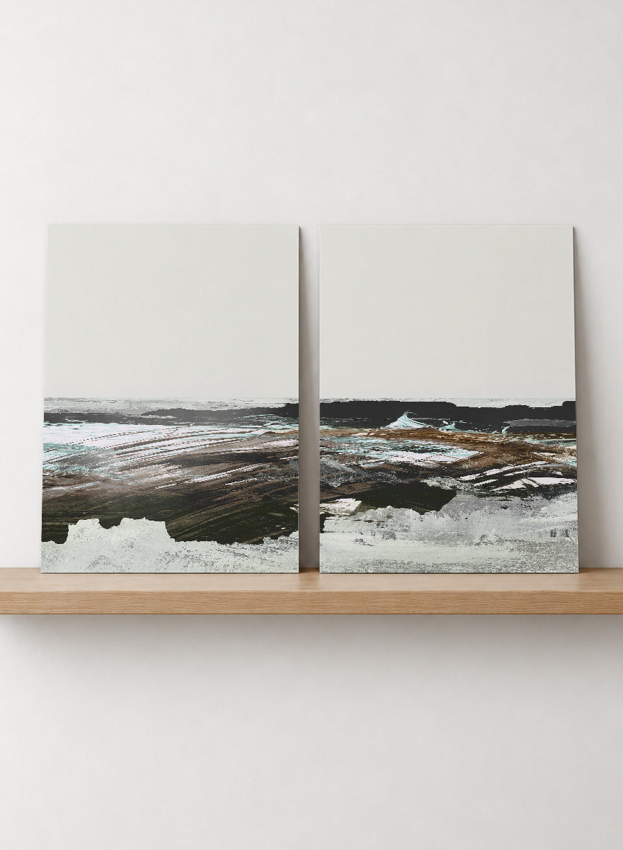 Shop Constantine Bay by Dan Hobday, a set of 2 coastal landscape wall art prints posters featuring windswept shoreline, surf, and muted blue-brown tones.