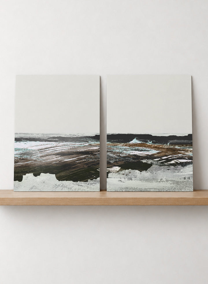 Shop Constantine Bay by Dan Hobday, a set of 2 coastal landscape wall art prints posters featuring windswept shoreline, surf, and muted blue-brown tones.