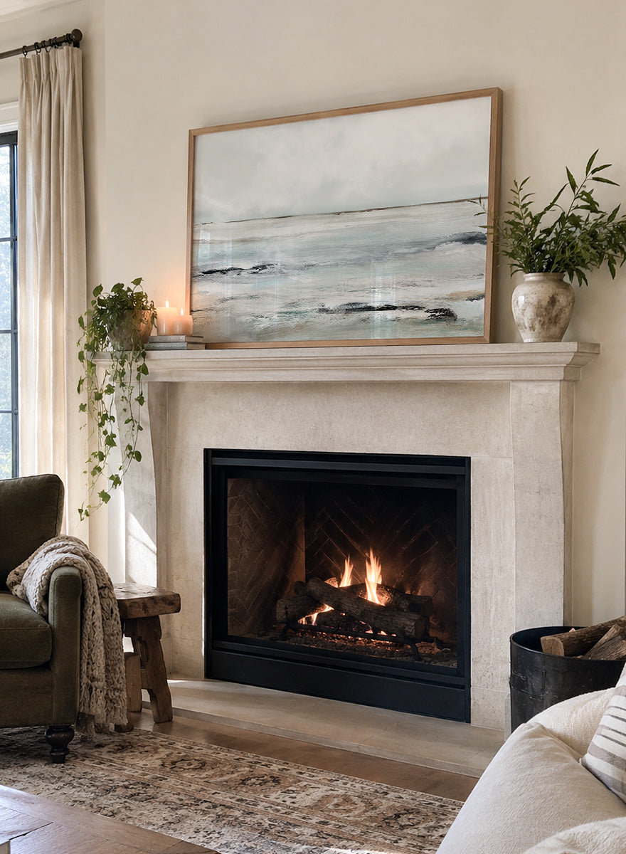 Shop Sandy Bay by Dan Hobday, a coastal landscape art print featuring soft blue-gray water, pale sky, textured shoreline, and layered neutral brushwork.