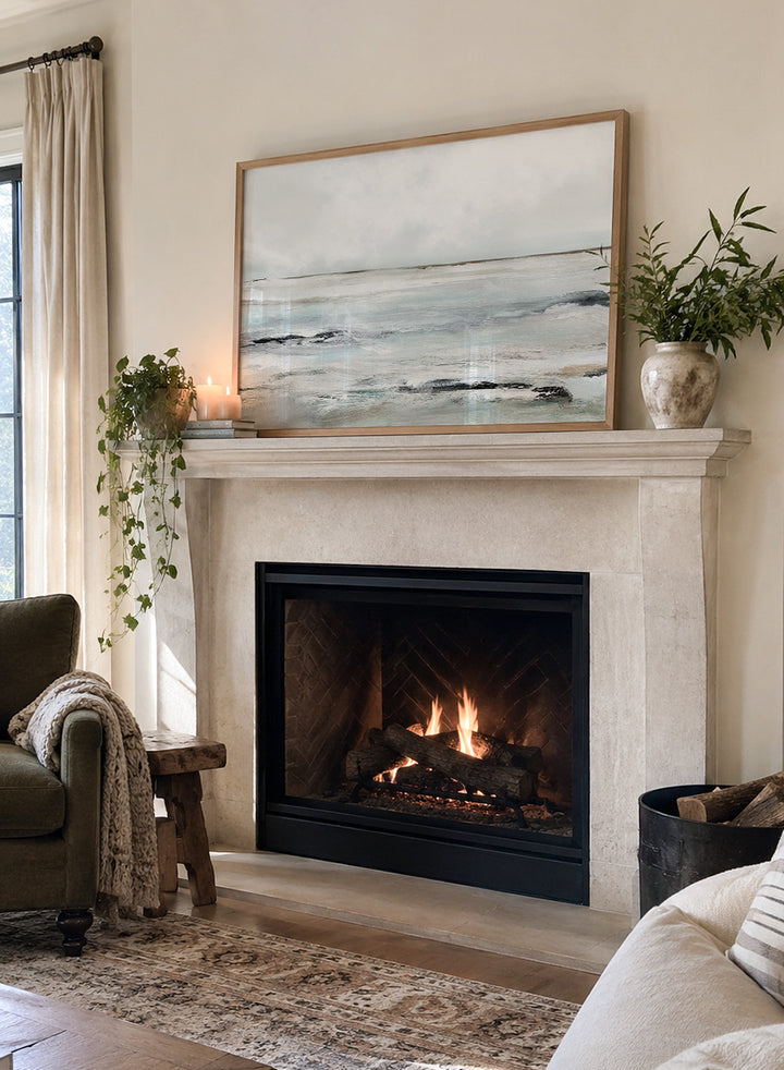 Shop Sandy Bay by Dan Hobday, a coastal landscape art print featuring soft blue-gray water, pale sky, textured shoreline, and layered neutral brushwork.