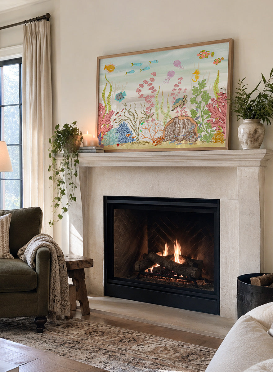 A framed art print depicting a colorful underwater scene with fish, coral, sea plants, a turtle, and a clam shell on a sandy ocean floor, shown against a light neutral background. Shop Vibrant Underwater World by Nikita Jariwala, an ocean wall art print poster with sea turtles, tropical fish, coral reef art, jellyfish, and blue tones.