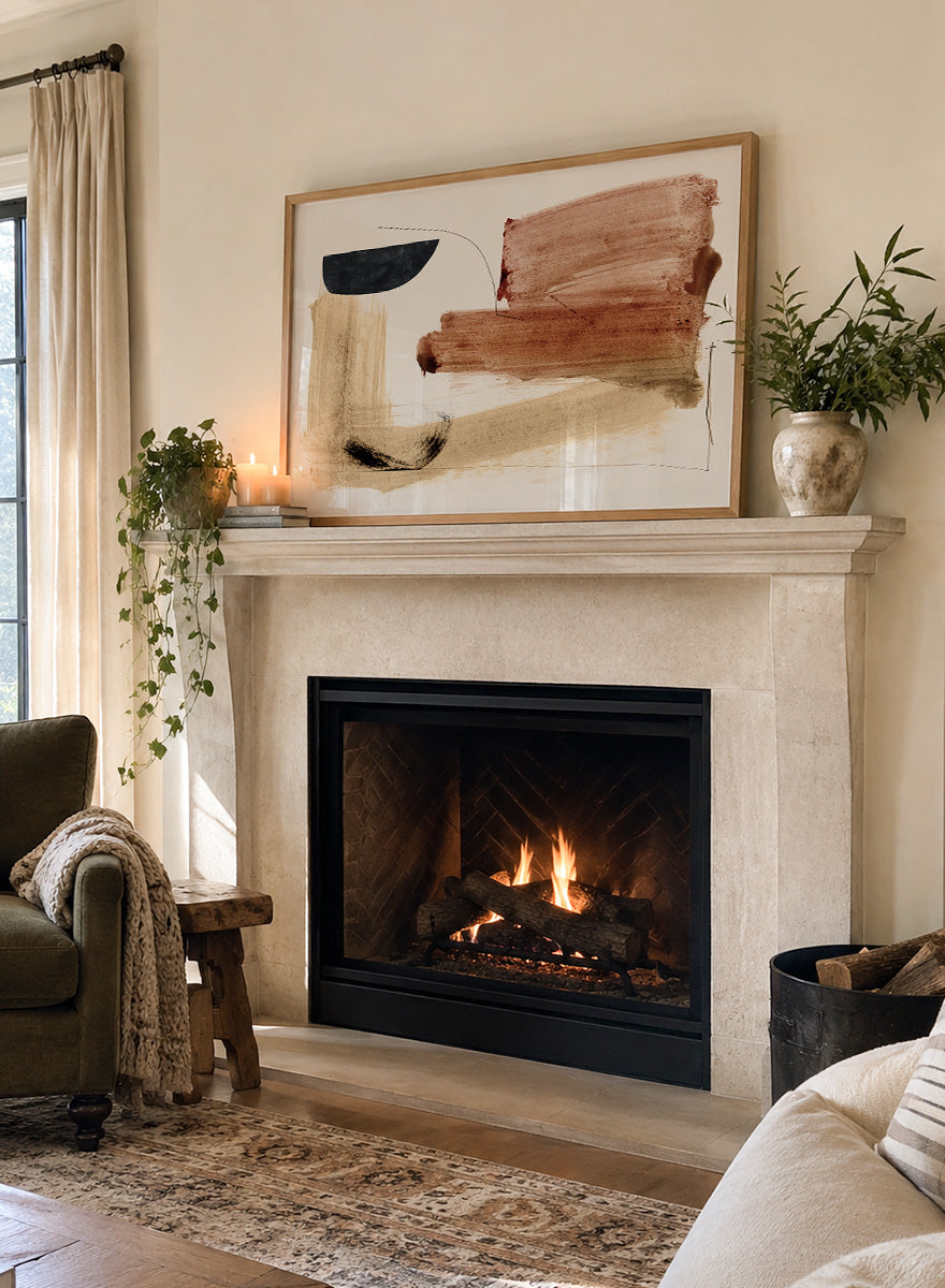 Abstract framed wall art featuring broad brushstrokes in terracotta, beige, black, and brown on a cream background. Shop Cooking by Dan Hobday, a warm abstract art print featuring rust brown, black, and sandy neutral forms with loose lines and layered brush texture.