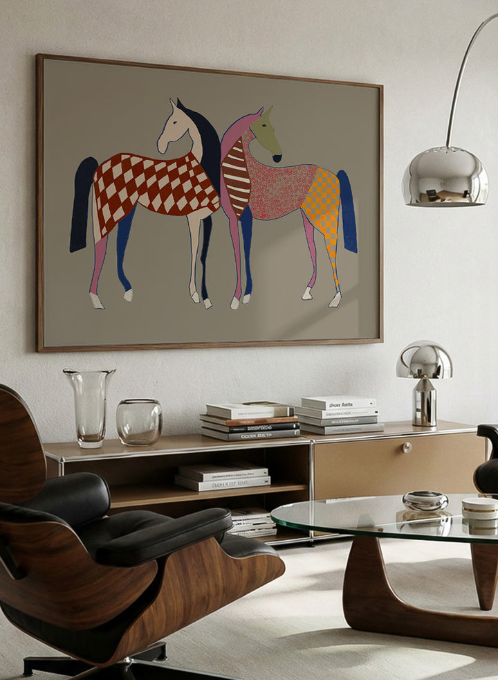 A framed art print featuring two stylized horses with colorful geometric patterns, set against a solid taupe background. Colorful Patterned Horses by The Art Concept animal art print featuring two horses with checks, stripes, florals, and bold playful color.