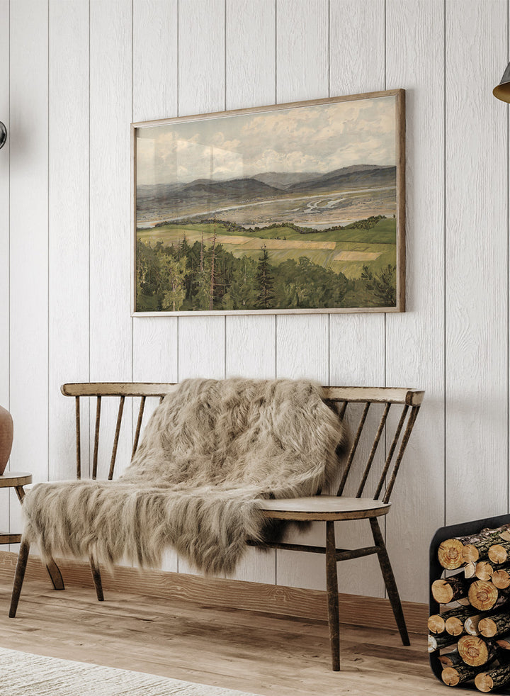 A framed landscape art print depicting rolling green and tan fields, distant mountains, a winding river, and a cloudy sky. Mountain Landscape by Arkadi Afanasyevich Chumakov is a vintage landscape art print featuring forest, fields, mountains, and a winding river.