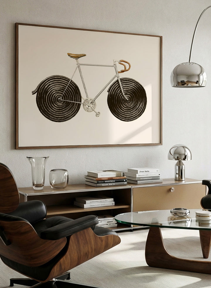 Framed artwork of a bicycle with spiral wheels on a beige background. Sweet Licorice Bicycle by Florent Bodart is a surreal bicycle art print with playful design and vintage style, a modern wall poster with creative and unique concept.