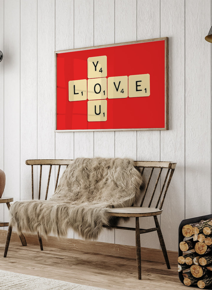 Scrabble tiles spelling LOVE YOU on a red background. Love You by Florent Bodart is a playful crossword-style art print featuring letter tiles spelling LOVE YOU on a red background. Retro typography wall poster with optional framing.