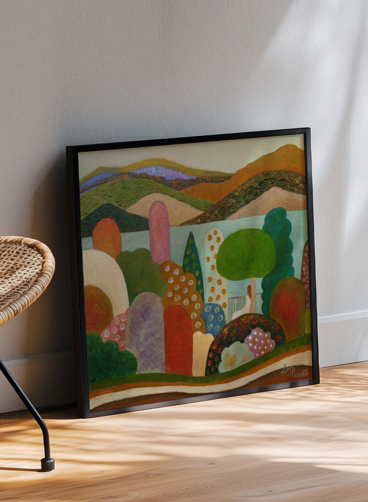 A framed landscape painting featuring stylized hills, trees, and abstract shapes in earthy tones of green, brown, orange, red, blue, and purple. Shop Vibrant Whimsical Landscape by Angeles M. Pomata, a colorful landscape art print with layered hills, patterned trees, and a soft dreamlike feel.