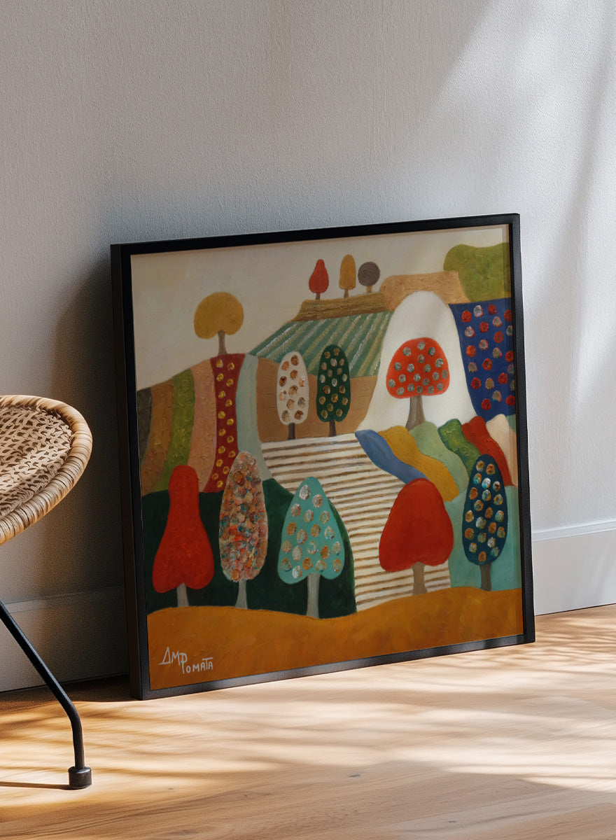 A framed abstract landscape painting featuring stylized trees, hills, and geometric shapes in red, blue, green, yellow, beige, and brown tones. Shop Whimsical Tree Landscape by Angeles M. Pomata, a colorful landscape art print featuring patterned trees, patchwork hills, and warm autumn tones.