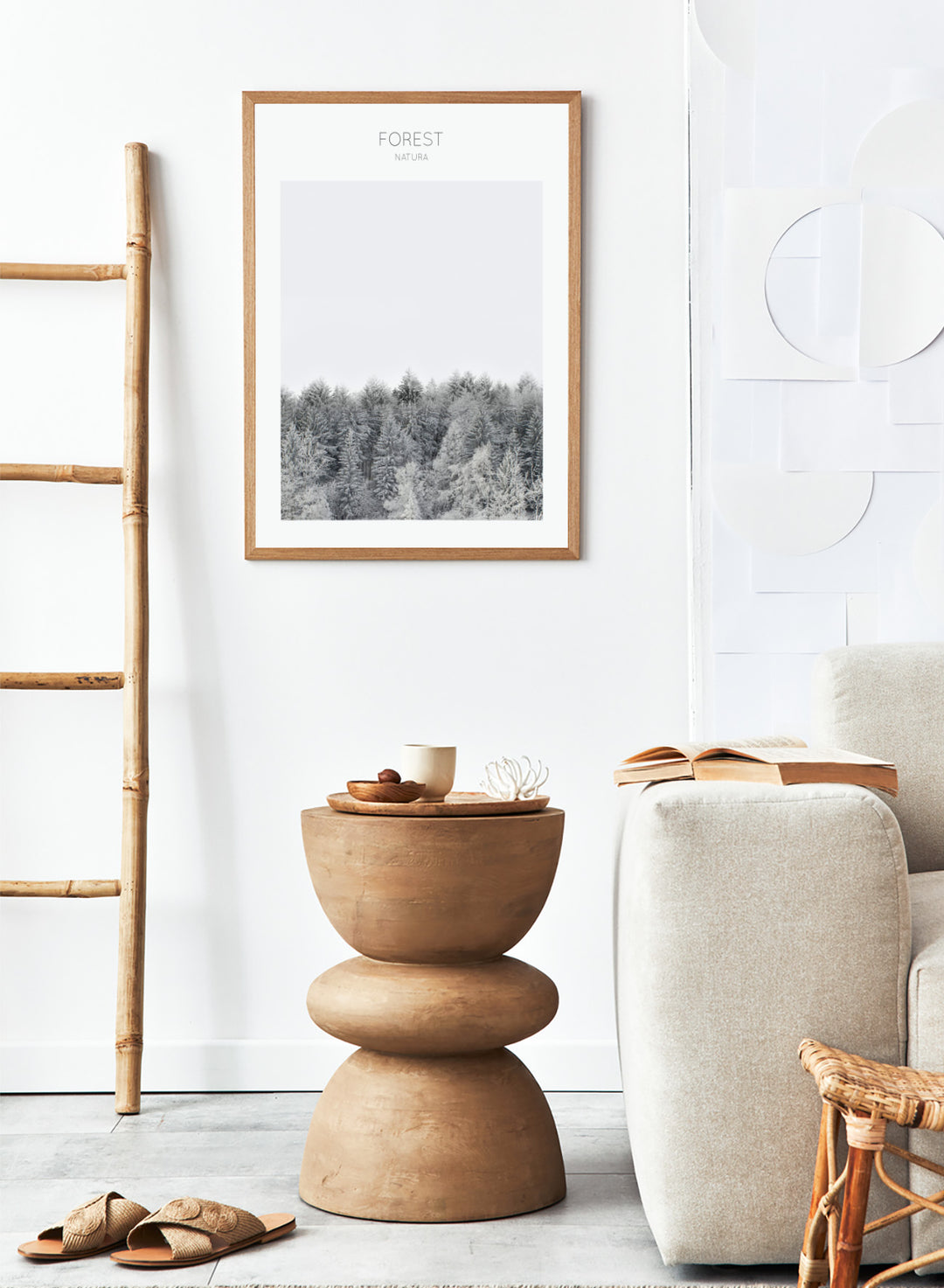 Black and white forest landscape with 'FOREST' and 'Natura' text at the top. Frosted Tranquility by The MIUUS Studio is a black and white forest photography art print and wall poster featuring snowy trees, minimalist composition, and modern neutral design.