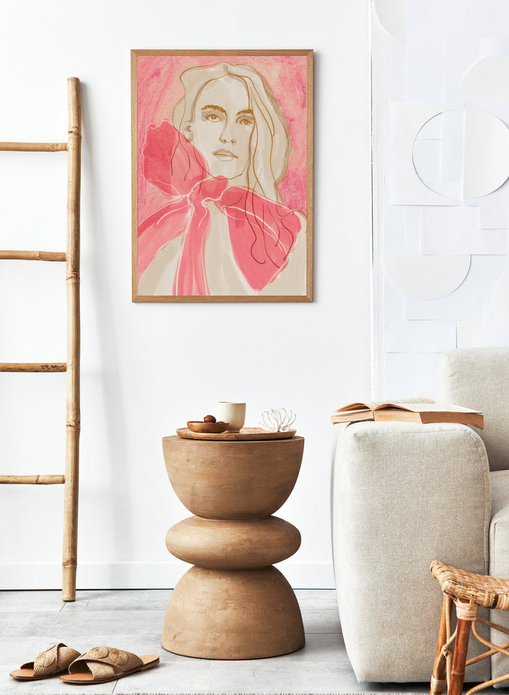 Artistic illustration of a woman with a pink bow tie on a pink background. Ethereal Red by Beate Tubach is a modern portrait art print featuring expressive linework and flowing red tones. A contemporary figurative wall poster.