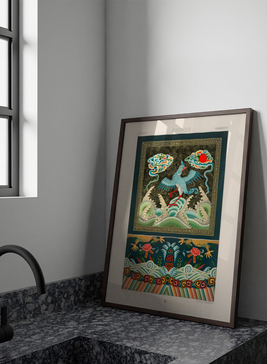 A framed art print featuring a traditional Chinese illustration with a blue bird, waves, clouds, and a red sun. Chinese Pattern by Albert Racinet vintage art print from an 1888 edition of L’Ornement Polychrome, featuring a crane, waves and colorful Chinese ornament.